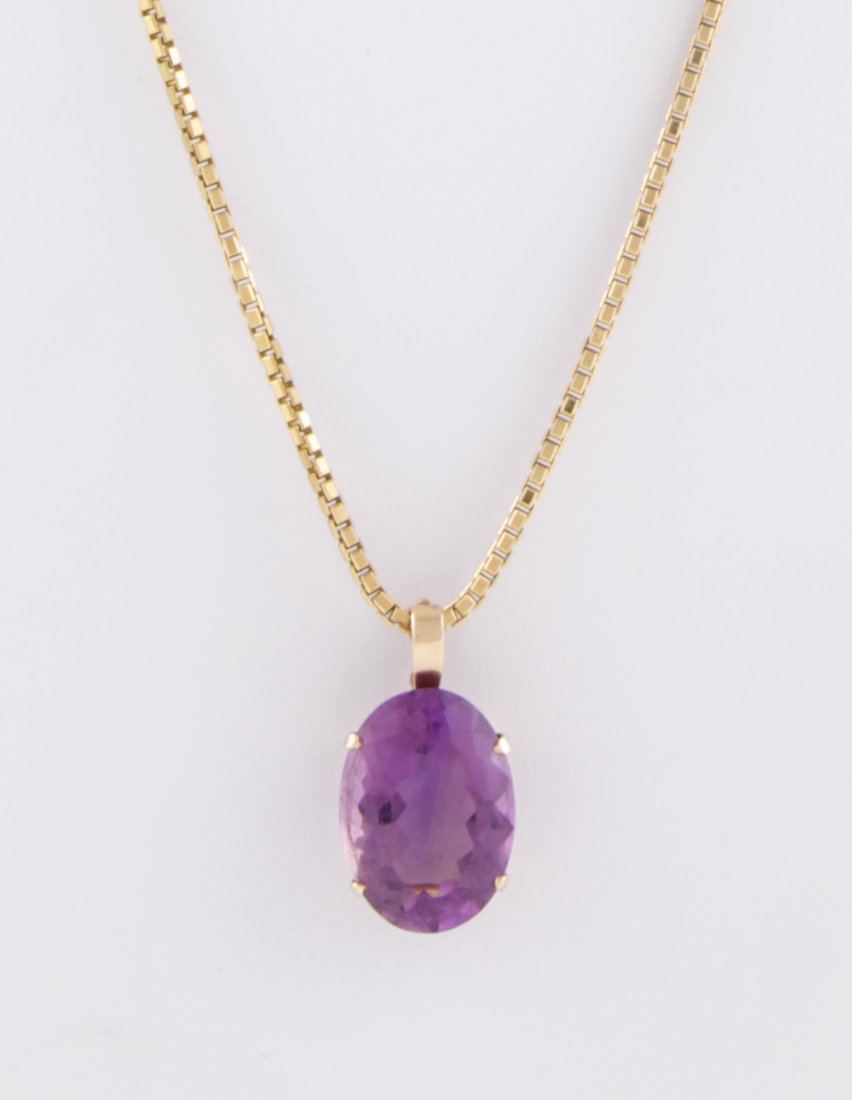 Gold and Amethyst Necklace: Gold and Amethyst Necklace. Faceted Oval Amethyst set in Gold Removable Mounting (used for pearl enhancer) on a 10K Box Chain marked Italy. 24"L (61 cm). 23 g.Since 1937, the The Silver Shop of Prince