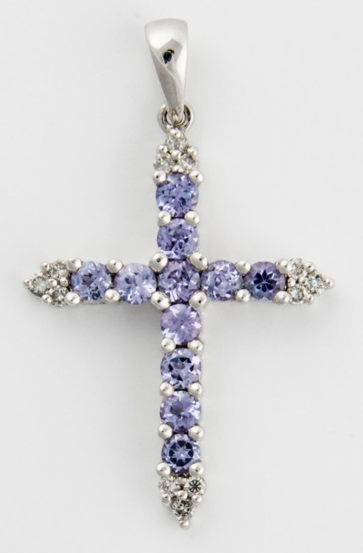 Amethyst and Diamond Cross Pendant set in 14K White: Amethyst and Diamond Cross Pendant set in 14K White Gold. Size: 1" x 3/4" (2.5 x 2 cm). 1.9 g. Since 1937, the The Silver Shop of Princeton, NJ was located at 59 Palmer Square West.