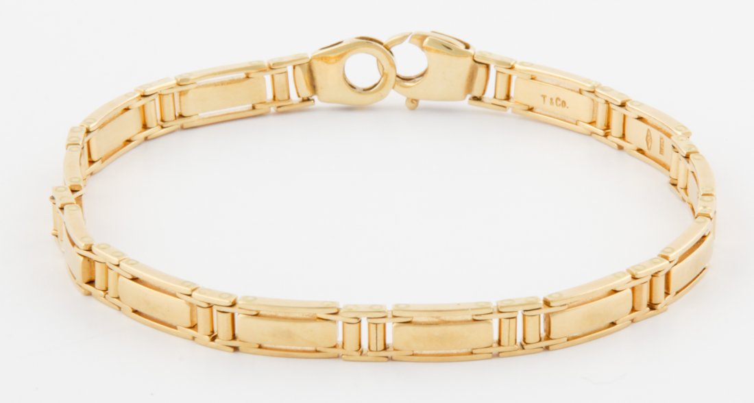 Heavy 18K Gold Bracelet by Tiffany: Heavy 18K Gold Bracelet by Tiffany marked T & Co. Italy. 8"L (20.5 cm). 25.8 g. Since 1937, the The Silver Shop of Princeton, NJ was located at 59 Palmer Square West.