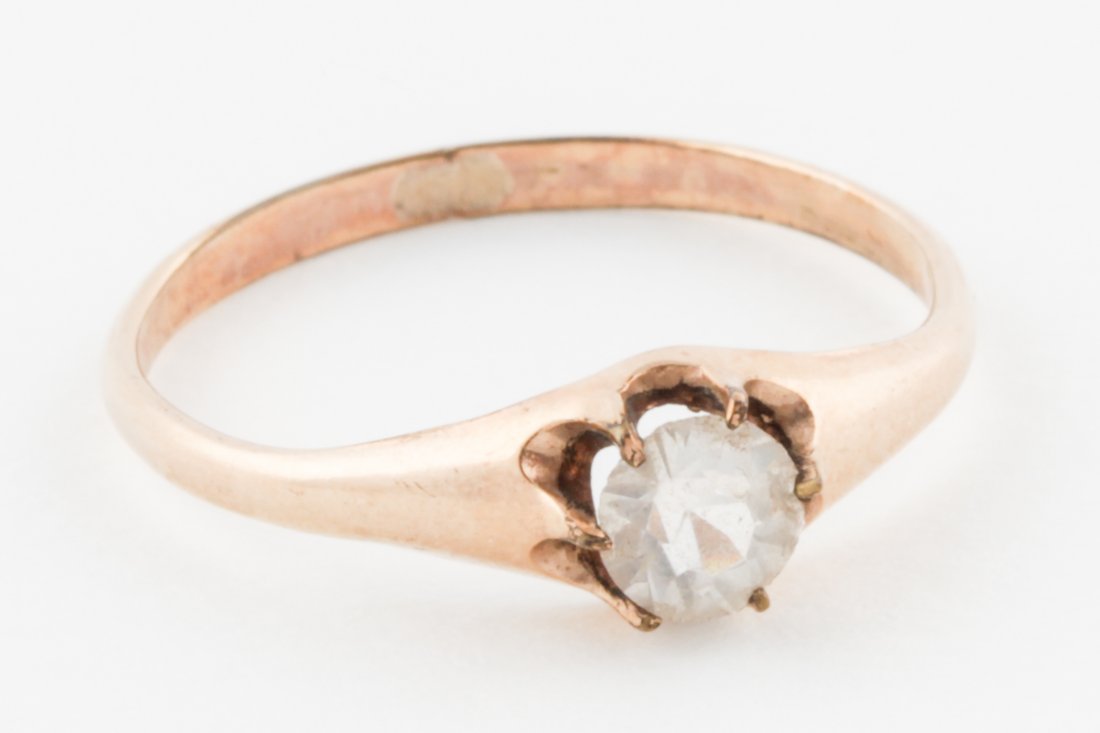 Solitaire Diamond Ring: Solitaire Diamond Ring prong-set with round-cut stone on unmarked Gold Band. Size 9.5. 1.6 g. Since 1937, the The Silver Shop of Princeton, NJ was located at 59 Palmer Square West.