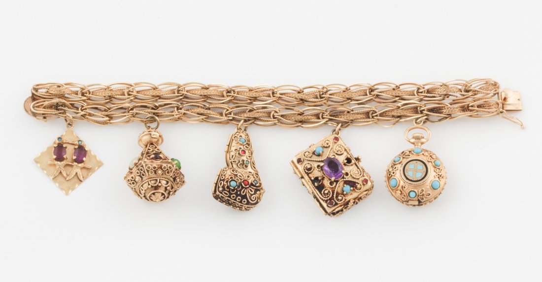 Heavy and Ornate Gem-set 14K Charm Bracelet: Heavy and Ornate Gem-set 14K Charm Bracelet featuring all-over beadwork and filigree. Certain Charms are hinged and open and the Pipe-shaped Element contains a separate Pipe inside. Nearly 3 ounces! m