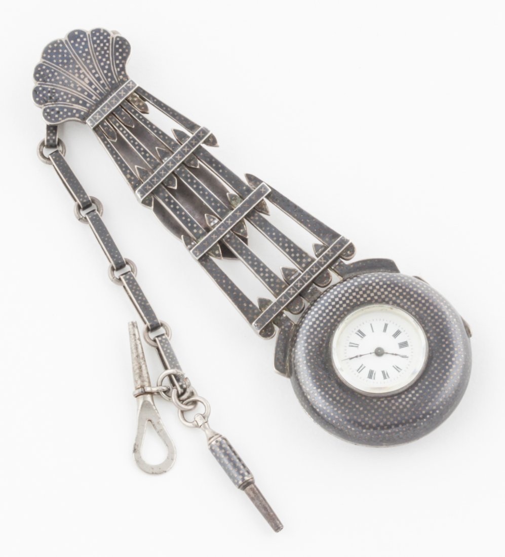 Silver Niello Chatelaine Pocket Watch: Silver Niello Chatelaine Pocket Watch. 4.5"L x 1.5"W (11 x 4 cm). 88 g. Since 1937, the The Silver Shop of Princeton, NJ was located at 59 Palmer Square West.