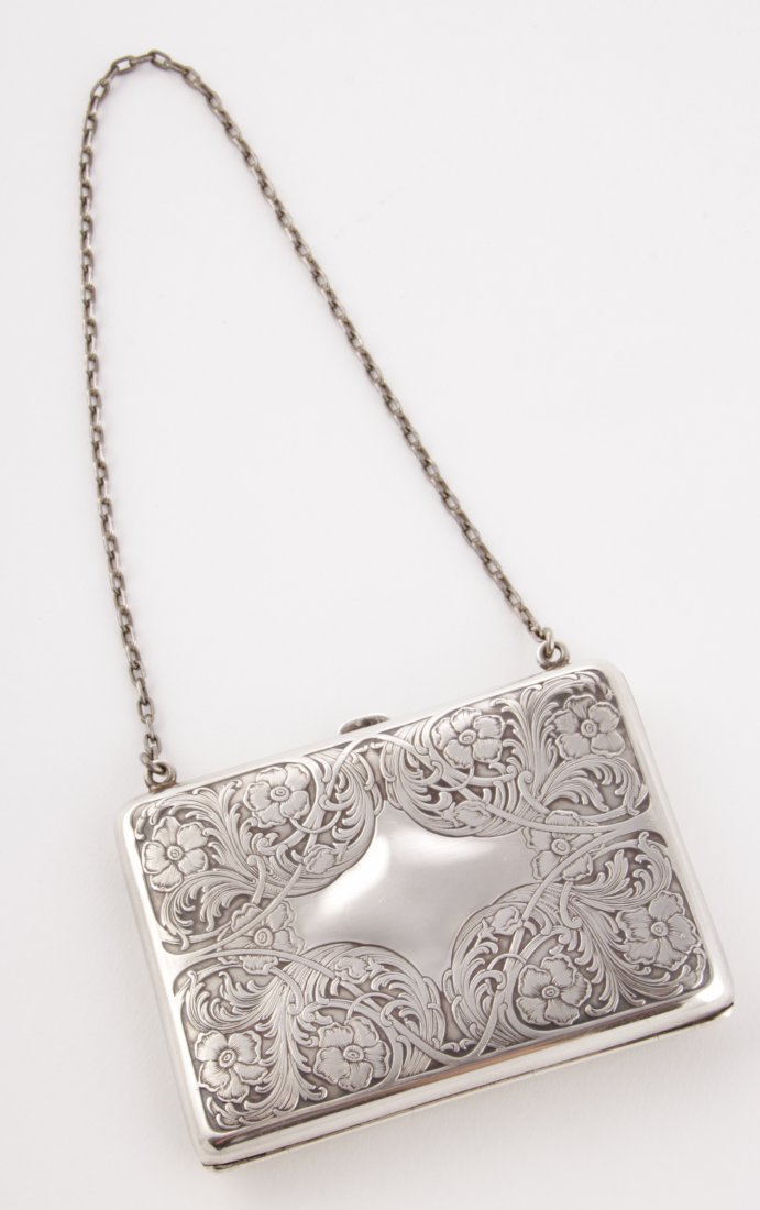 Antique Hand-Chased Silver Purse: Antique Hand-Chased Silver Purse. Marked Sterling. Tears to Silk Lining. 3.5" x 2.5". 3.24 ozt. Since 1937, the The Silver Shop of Princeton, NJ was located at 59 Palmer Square West.