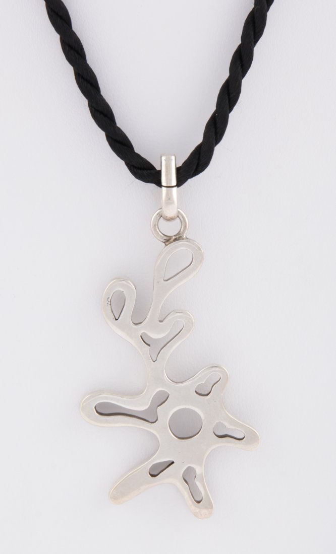 Lively Sterling Silver Abstract Pendant on Silk Cord: Lively Sterling Silver Abstract Pendant on Silk Cord Necklace marked 925. 19.3 g. Since 1937, the The Silver Shop of Princeton, NJ was located at 59 Palmer Square West.