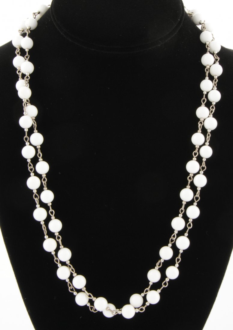 White Onyx Beaded Necklace: White Onyx Beaded Necklace. 44"L (112 cm). 57.8 g. Since 1937, the The Silver Shop of Princeton, NJ was located at 59 Palmer Square West.