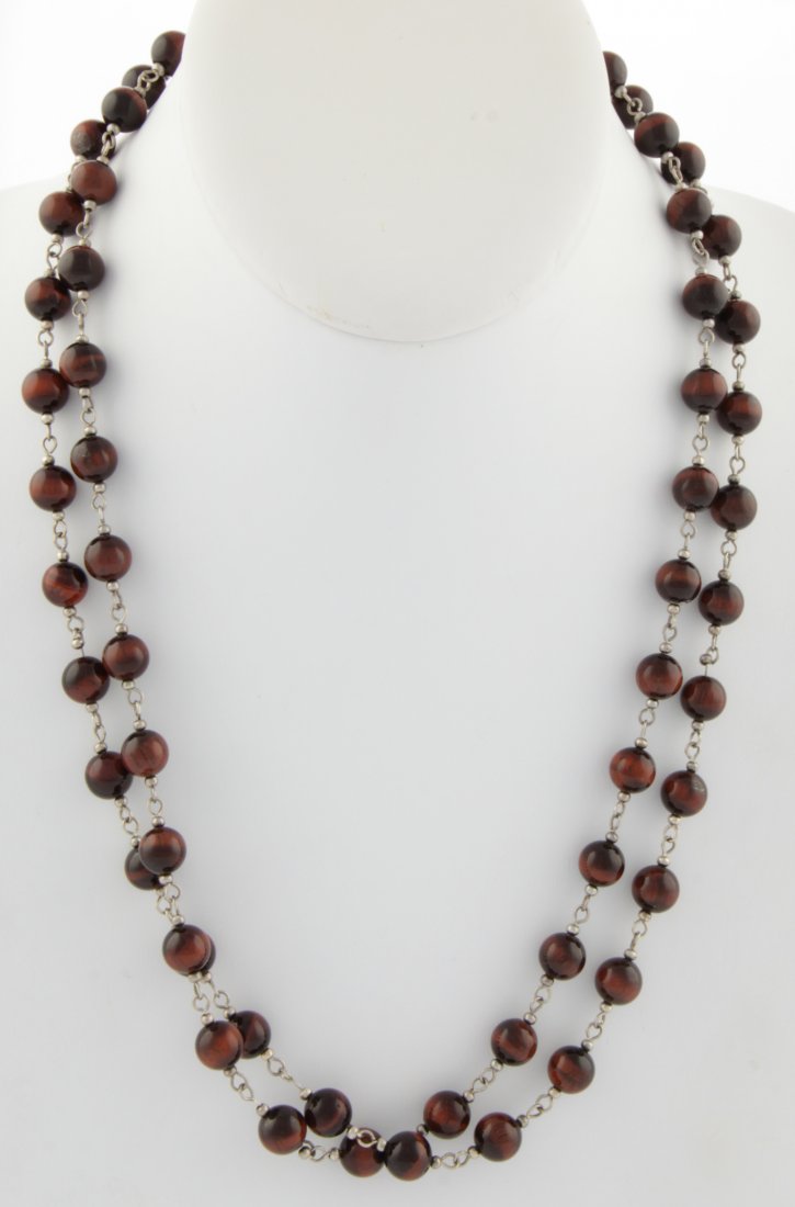 Tiger Eye Beaded Necklace: Tiger Eye Beaded Necklace. Length: 42" (107 cm). 60.3 g . Since 1937, the The Silver Shop of Princeton, NJ was located at 59 Palmer Square West.