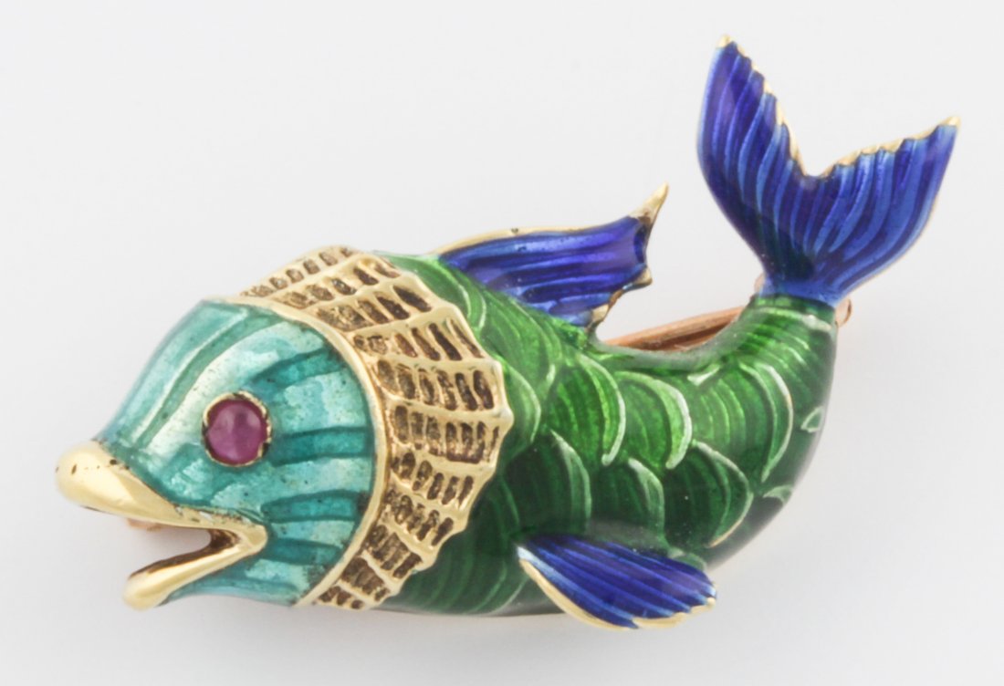 14K Gold and Enamel Fish Pin: Gold and Enamel Fish Pin. Lively and artistic Enamel Fish Pin with Ruby Eye. Marked 14K. Size: 1.25L (3 cm). 7.2 g. Since 1937, the The Silver Shop of Princeton, NJ was located at 59 Palmer Square Wes