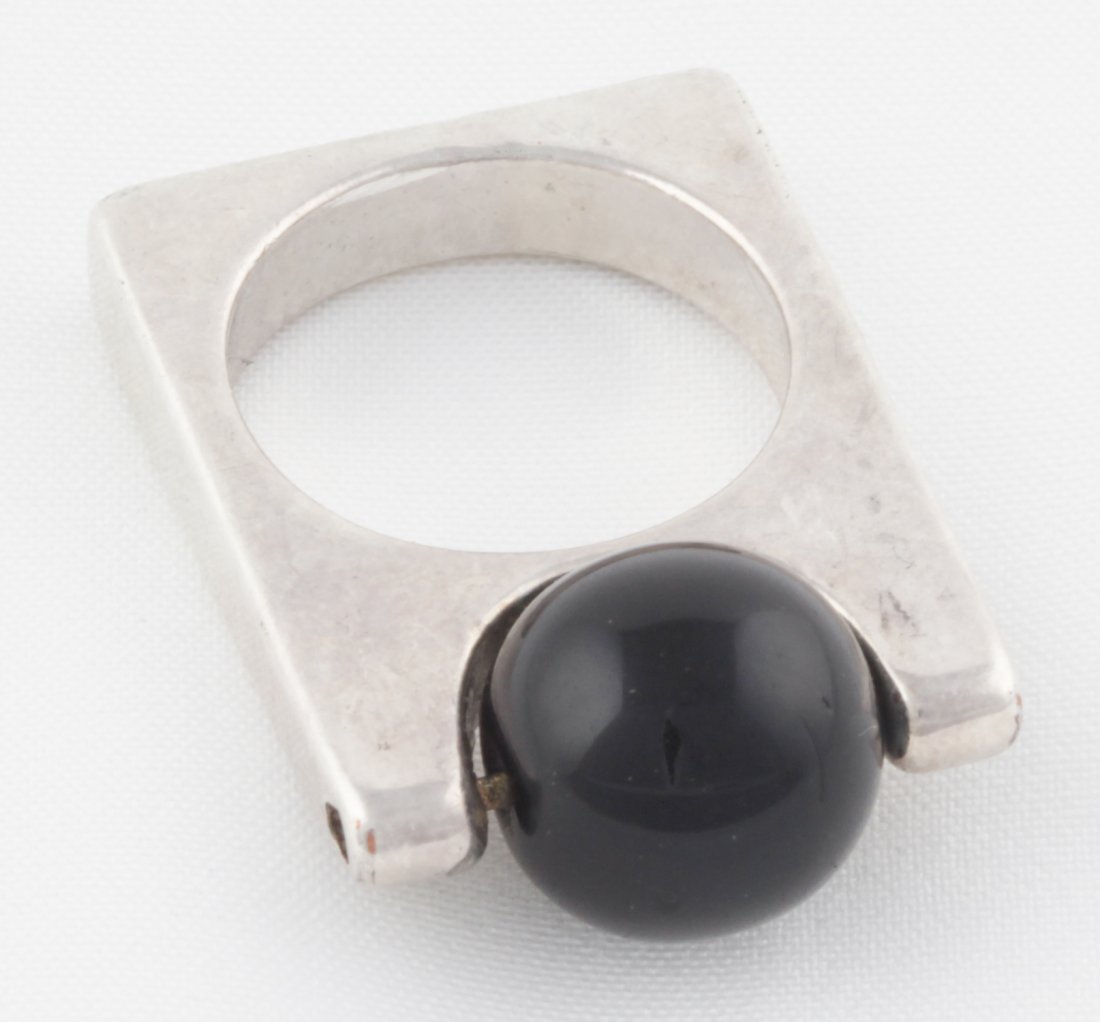 Mod French Kinetic Ring Consisting of Rolling Onyx Bead: Mod French Kinetic Ring consisting of Rolling Onyx Bead mounted in square-form Geometric Ring by Scooter Paris. Size 5.5. Since 1937, the The Silver Shop of Princeton, NJ was located at 59 Palmer Squa