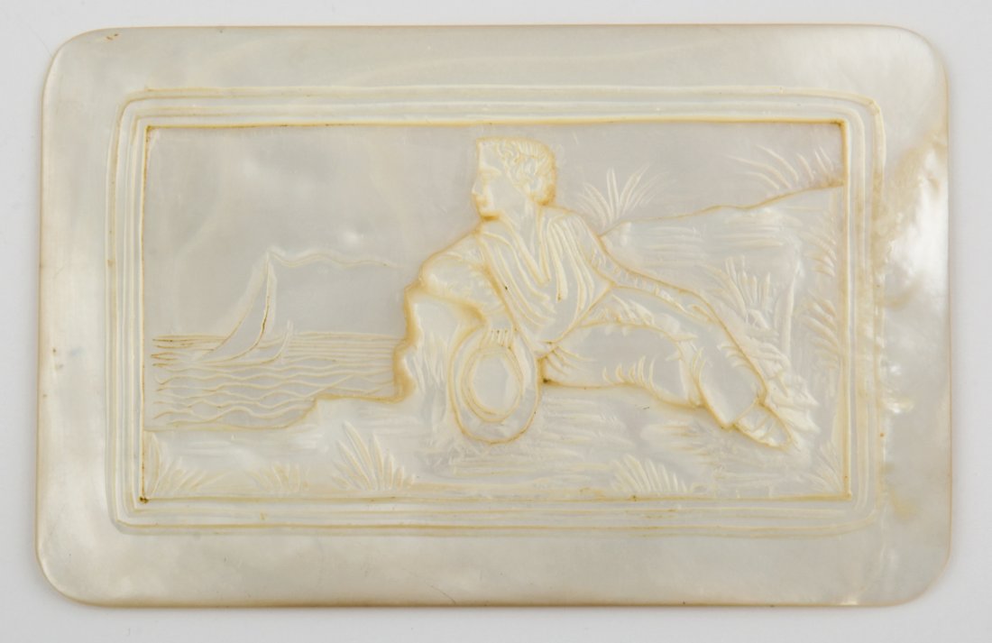 Artistically Carved Mother of Pearl Plaque: Artistically carved Mother of Pearl Plaque of man gazing at boat on the sea.Very largeSize: 2" x 3.25" (5 x 8 cm). 34.2 g. Since 1937, the The Silver Shop of Princeton, NJ was located at 59 Palmer Squ