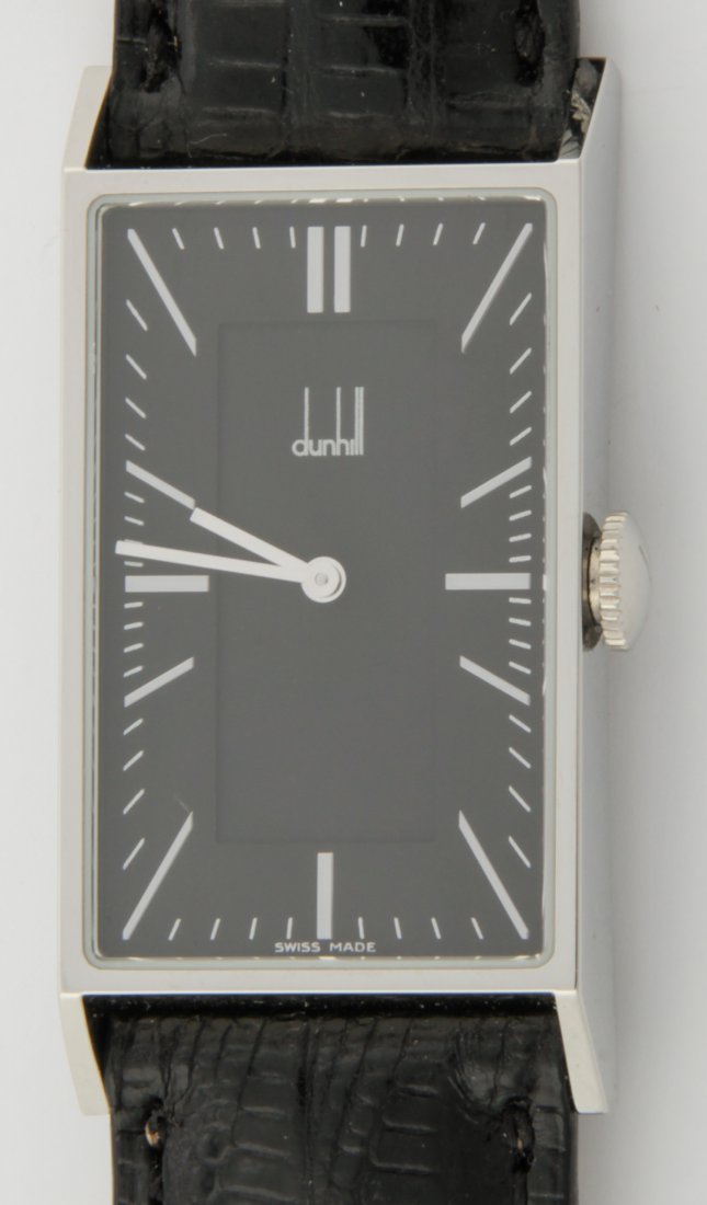Dunhill Wrist Watch in Unused Condition: Dunhill Swiss Made Wrist Watch in Unused Condition. Marked 1&05, UF11236, 8036, PL HB Quartz DQ5001 AM with Original Packaging. May need Battery. 1.5"x .75". 31.15 g.Since 1937, the The Silver Shop of