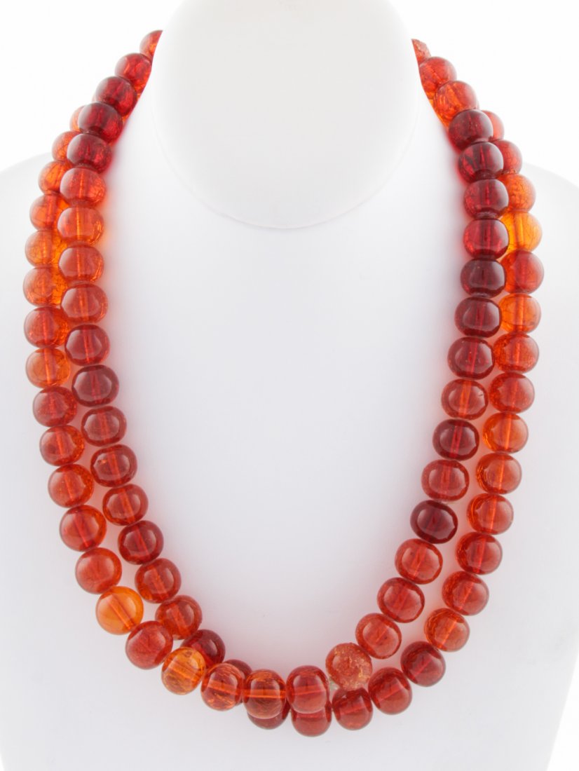 Amber-Colored Bead Necklace: Amber-Colored Bead Necklace. 42"L (106 cm). 114.1 g. Since 1937, the The Silver Shop of Princeton, NJ was located at 59 Palmer Square West.
