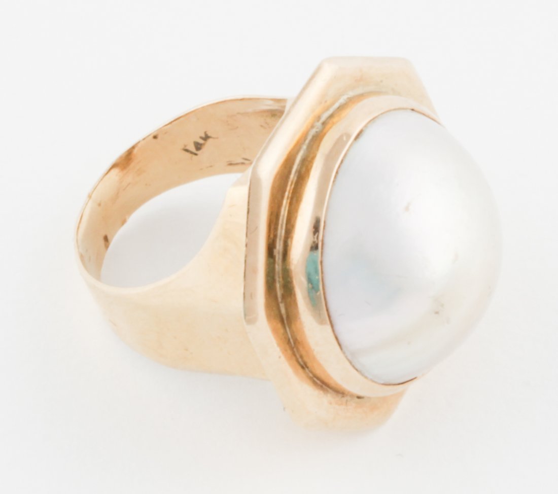 Huge Mabe Pearl and 14 K Gold Ring: Huge Mabe Pearl bezel-set in 14K Octagonal-shaped Ring. Size 6.5. 13.7 g. Since 1937, the The Silver Shop of Princeton, NJ was located at 59 Palmer Square West.