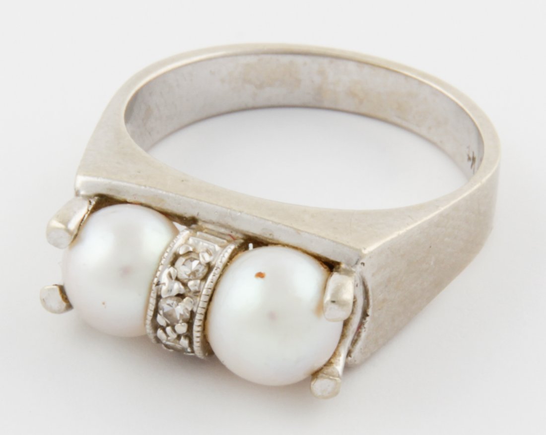 14K White Gold Pearl and Diamond Ring: White Gold Pearl and Diamond Ring marked 14K. Size: 6. 4.7 g. Since 1937, the The Silver Shop of Princeton, NJ was located at 59 Palmer Square West.