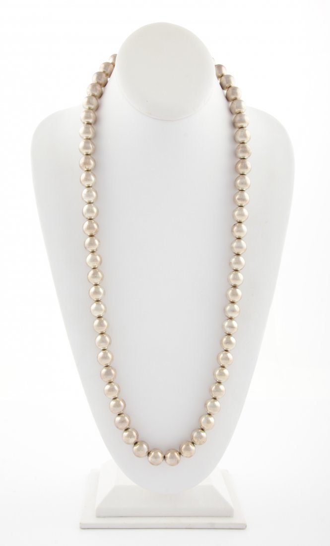 Silver Beaded Necklace: Silver Beaded Necklace marked Sterling. 28"L (71 cm). 157.4 g. Since 1937, the The Silver Shop of Princeton, NJ was located at 59 Palmer Square West.