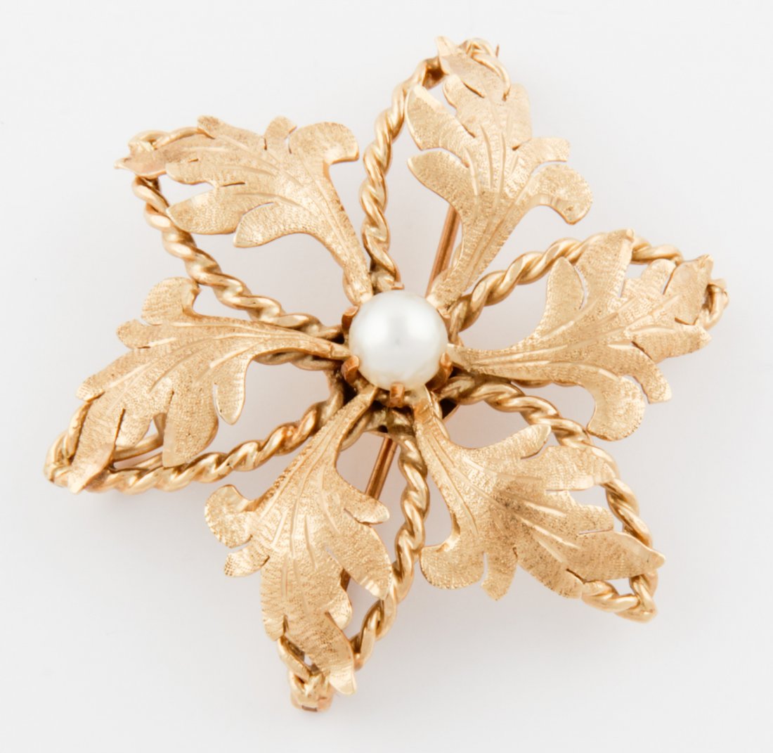 14K Gold and Pearl Flora Pin: Gold and Pearl Flora Pin marked 14K. Size: 1.5"D (4 cm). 10 g. Since 1937, the The Silver Shop of Princeton, NJ was located at 59 Palmer Square West.