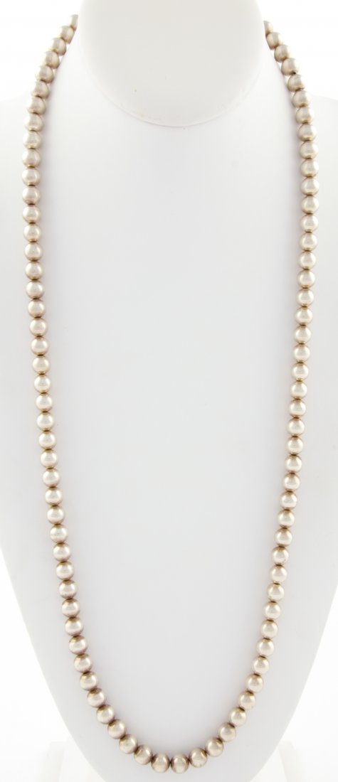 Stunning Silver Beads Necklace: Stunning Silver Beads Necklace marked Sterling. 30"L (76 cm). 58.5 g. Since 1937, the The Silver Shop of Princeton, NJ was located at 59 Palmer Square West.