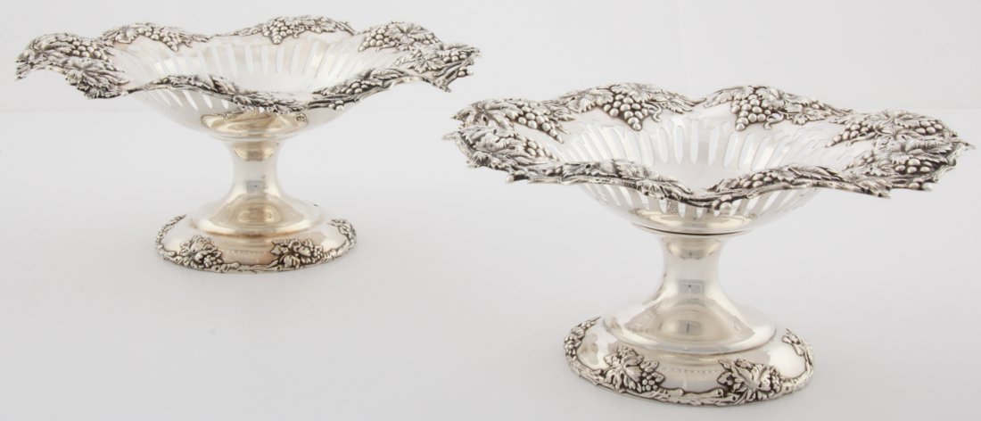 2 Antique Loring and Andrews Silver Tazzae: Silver Tazzae. 2 Antique Compotes on Stands by Loring and Andrews have Undulating Rims and Reticulated Bowls with Heavy Grape Decoration to the Top and Bottom. Both marked Sterling 1788. Nice variatio