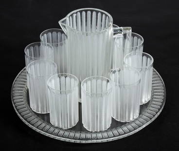 Rene Lalique Jaffa Lemonade Set: Rene Lalique Jaffa Lemonade Set with 10 etched crystal tumblers on matching tray with Pitcher. Tumblers and Pitcher signed "Lalique France". Cups 5"H (13 cm), Pitcher 9"H (23 cm), Tray unsigned