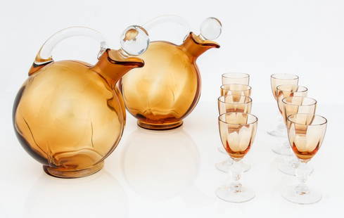 19th c. Sherry Service. 2 Amber Glass Decanters with: 19th c. Sherry Service. 2 Amber Glass Decanters with Stoppers 7.5" H (19 cm) and 8 Cordials 3.5"H (9 cm).Since 1937, the The Silver Shop of Princeton, NJ was located at 59 Palmer Square West.