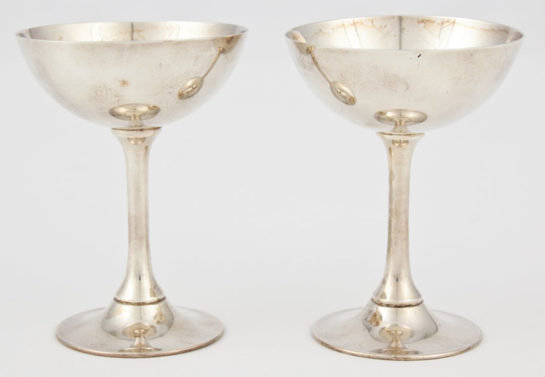 Pair of Silver Champagne Cups: Pair of Silver Champagne Cups, each marked Sterling 950. 2.75"D x 3.75"H (7 x 10 cm). Weight: 3.4 ozt. Since 1937, the The Silver Shop of Princeton, NJ was located at 59 Palmer Square West.