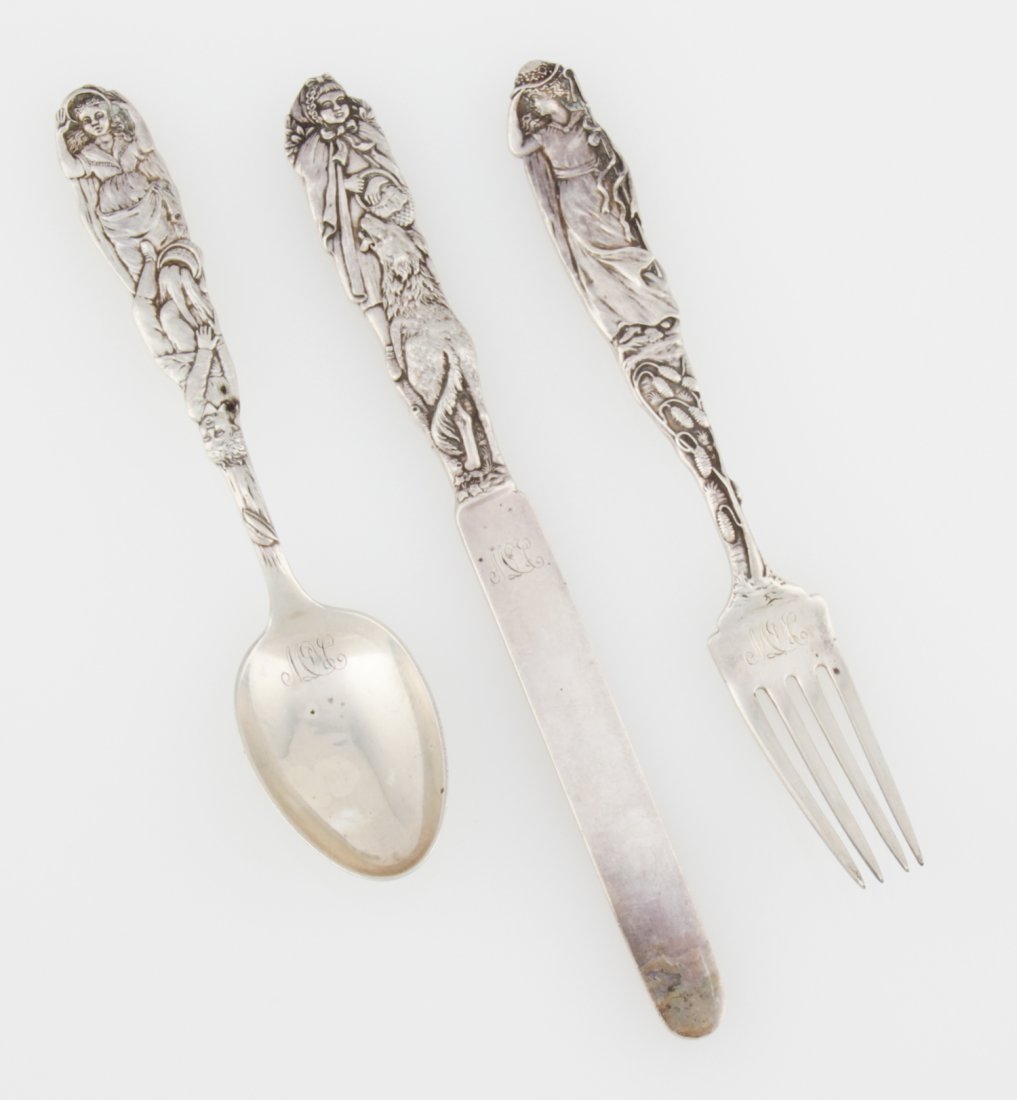 Tiffany & Co. Antique Nursery Rhyme Silver Flatware: Tiffany & Co. Silver Service. Antique Child's Nursery Rhyme Flatware. Marked Sterling. Monogrammed. Knife 7.5"L (19 cm), Fork and Spoon 6.5"L (17 cm) each. Weight: 177.9 g (total). Since 1937, the The