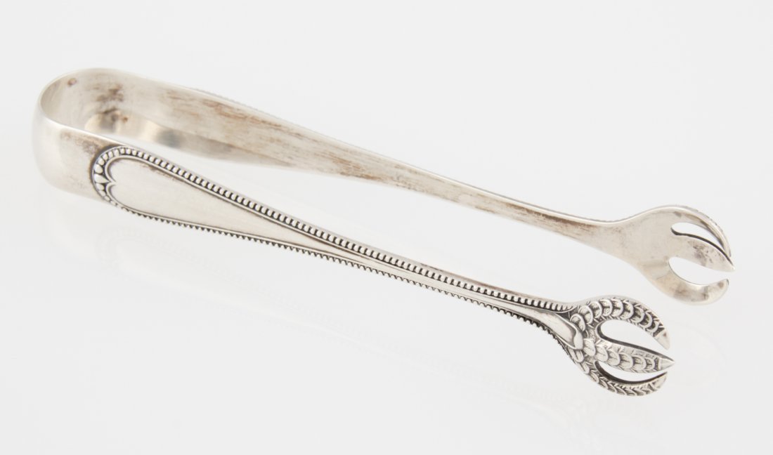 Gorham Silver Sugar Tongs: Gorham Silver Sugar Tongs marked Sterling. 4.25"L (11 cm). Weight: 20.8 g. Since 1937, the The Silver Shop of Princeton, NJ was located at 59 Palmer Square West.