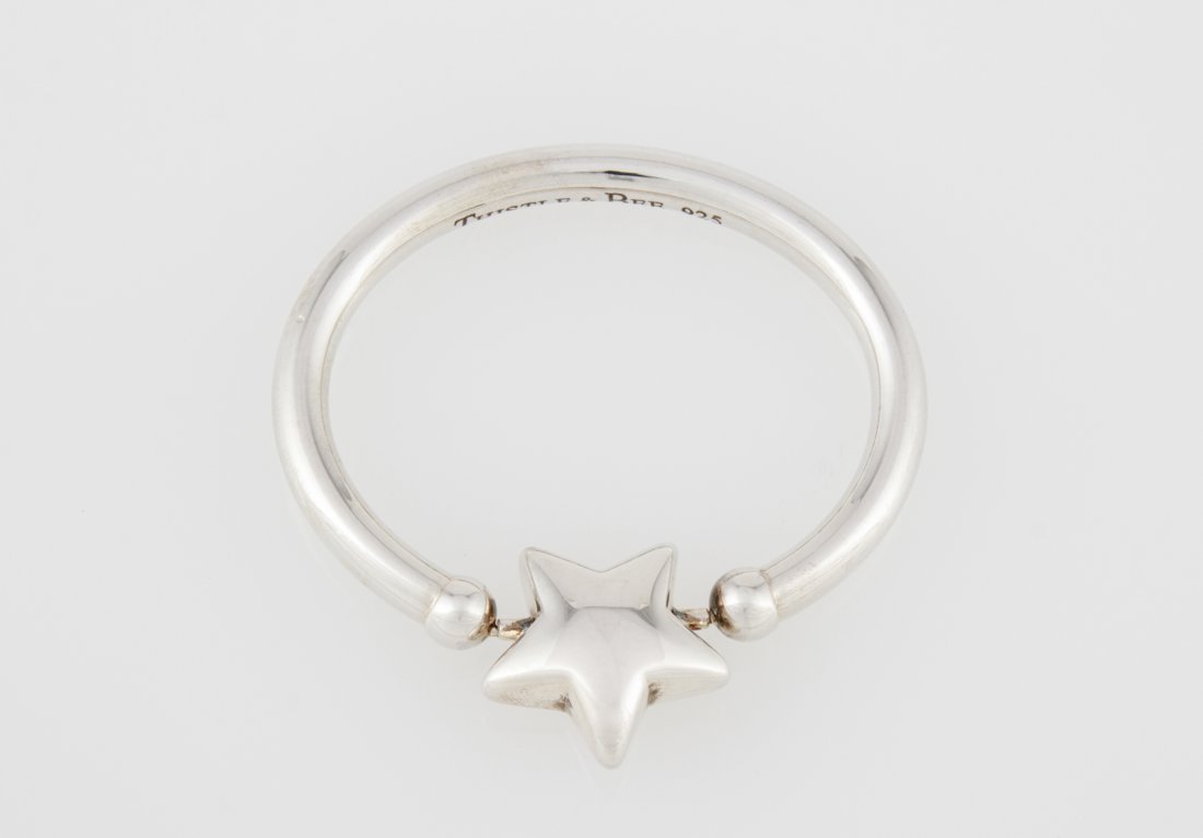 Sterling Baby Rattle with Spinning Star: Sterling Baby Rattle with Spinning Star marked 925. 2.75"W (7 cm). Weight: 22.2 g. Since 1937, the The Silver Shop of Princeton, NJ was located at 59 Palmer Square West.
