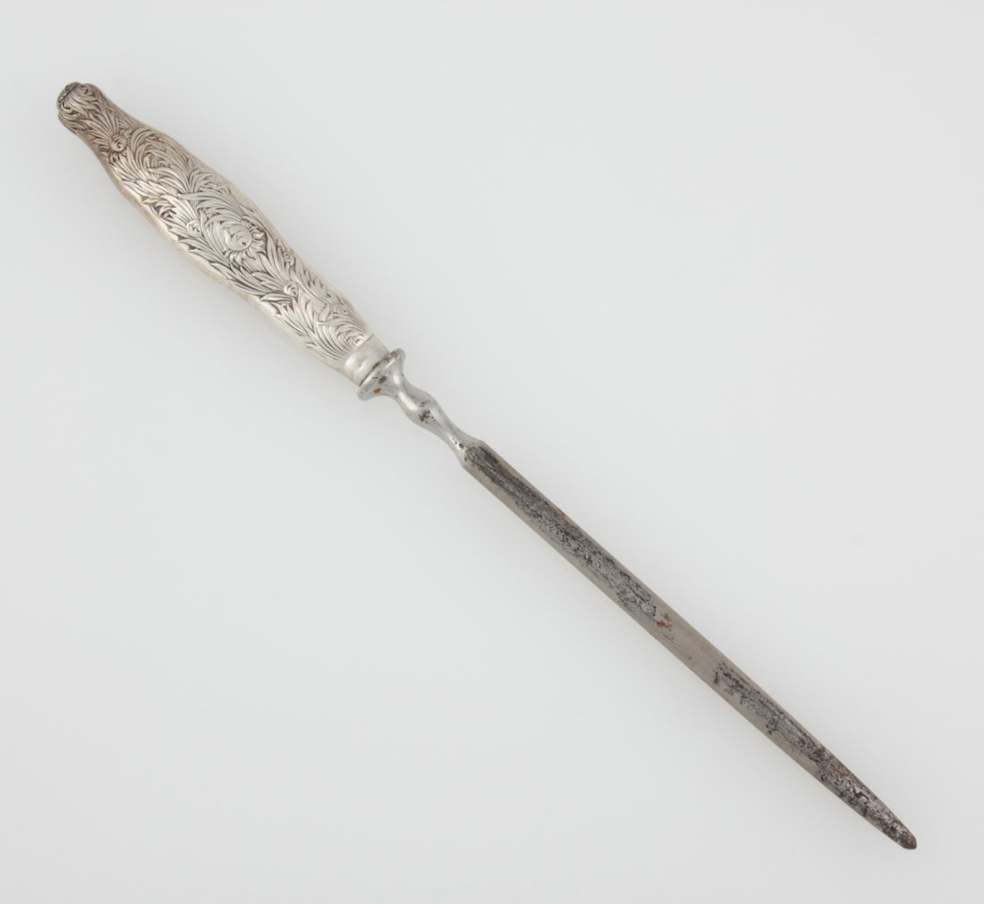 Tiffany & Co. Chrysanthemum Silver Knife Steel: Tiffany & Co. Silver Knife Steel in the "Chrysanthemum" Pattern. Handle marked Sterling. 13.25"L (34 cm). Weight: 6.7 ozt. Since 1937, the The Silver Shop of Princeton, NJ was located at 59 Palmer Squ