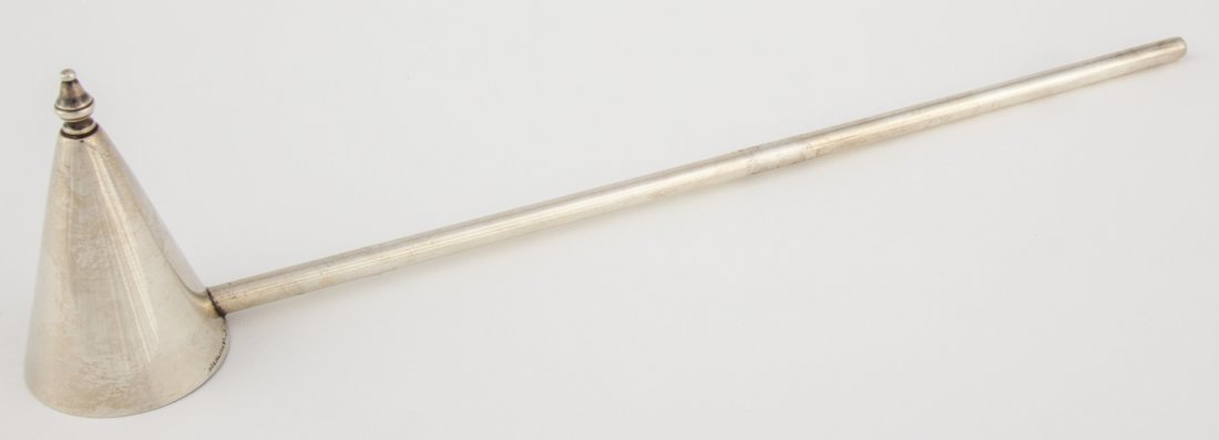 Graff Sterling Silver Candle Snuffer: Graff Sterling Silver Candle Snuffer. 10"L (25 cm). Weight: 35 g. Since 1937, the The Silver Shop of Princeton, NJ was located at 59 Palmer Square West.