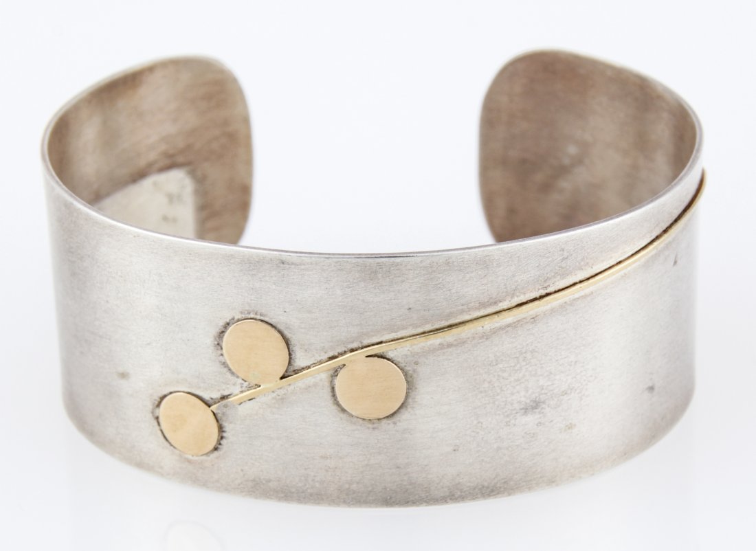 A. Tate Sterling Silver & 18K Cuff Bracelet: A. Tate Sterling Silver & 18K Cuff Bracelet. 2.5"W x 2"D x 1"H (6 x 5 x 3 cm). Weight: 32.7 g . Since 1937, the The Silver Shop of Princeton, NJ was located at 59 Palmer Square West.