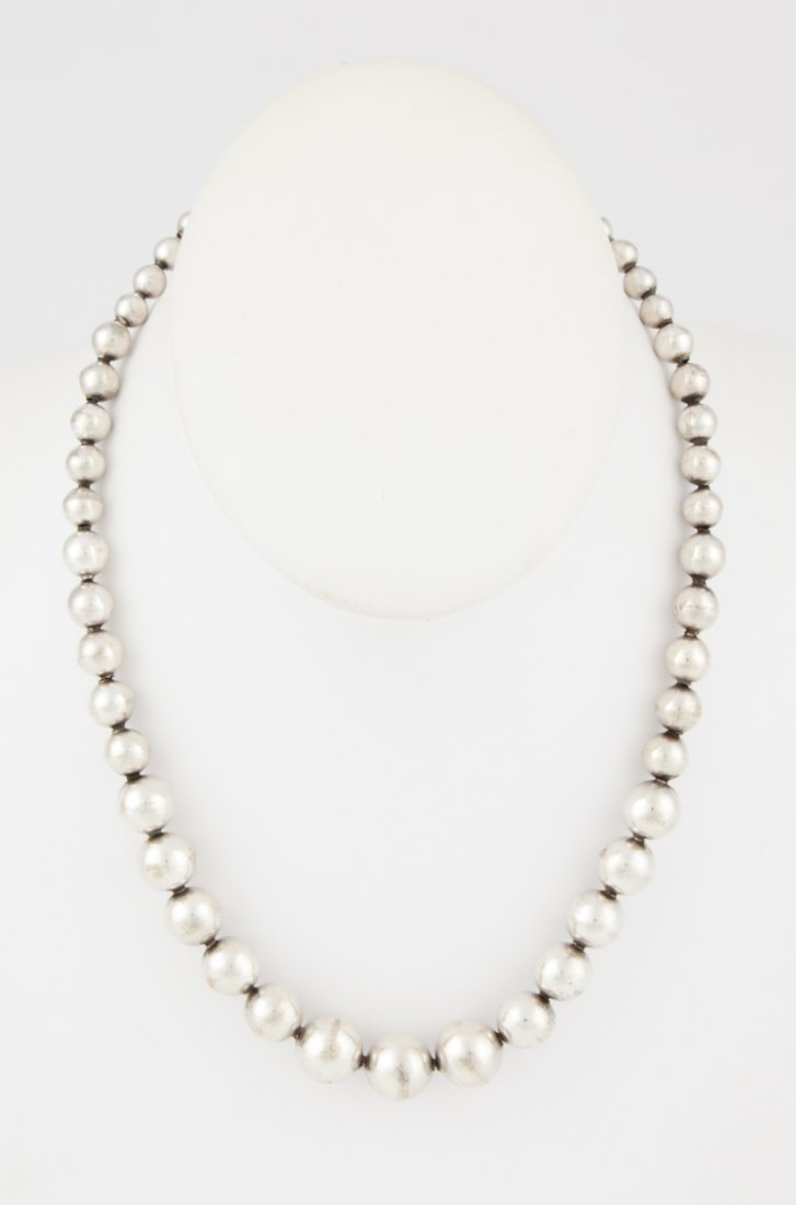 Silver Beaded Necklace: Silver Beaded Necklace marked Sterling. 17"L (43 cm). Weight: 19 g. Since 1937, the The Silver Shop of Princeton, NJ was located at 59 Palmer Square West.