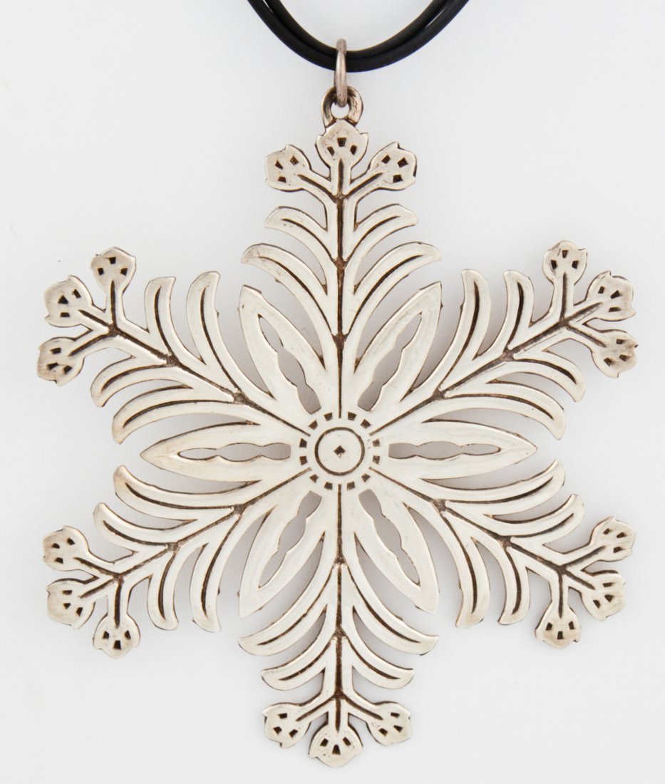 Sterling Silver Snowflake Pendant: Sterling Silver Snowflake Pendant. Christmas Tree Ornament 1973 on Triple Rubber Cord Necklace. 3.25" x 3.25" (8 x 8 cm). Since 1937, the The Silver Shop of Princeton, NJ was located at 59 Palmer Squa