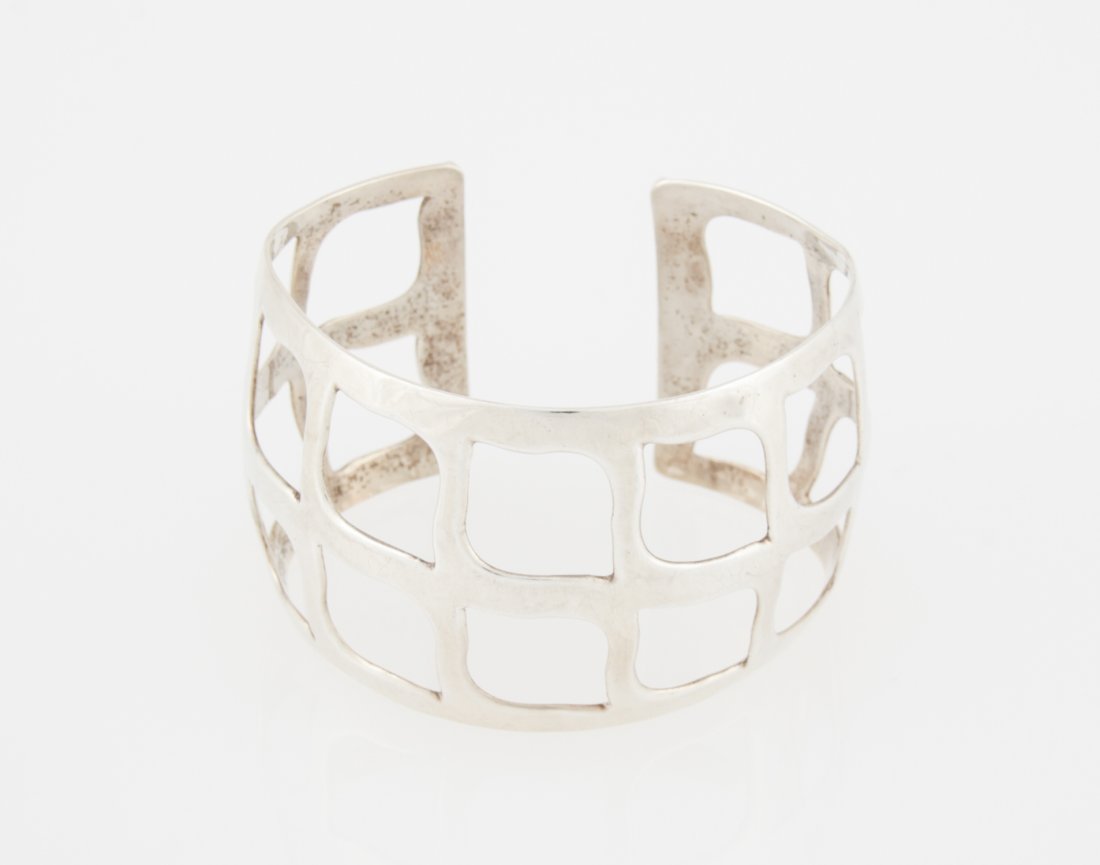 Sterling Openwork Cuff Bracelet: Sterling Openwork Cuff Bracelet. Signed Ilaria marked 925. 3"D (7 cm). Weight: 50.5 g. Since 1937, the The Silver Shop of Princeton, NJ was located at 59 Palmer Square West.