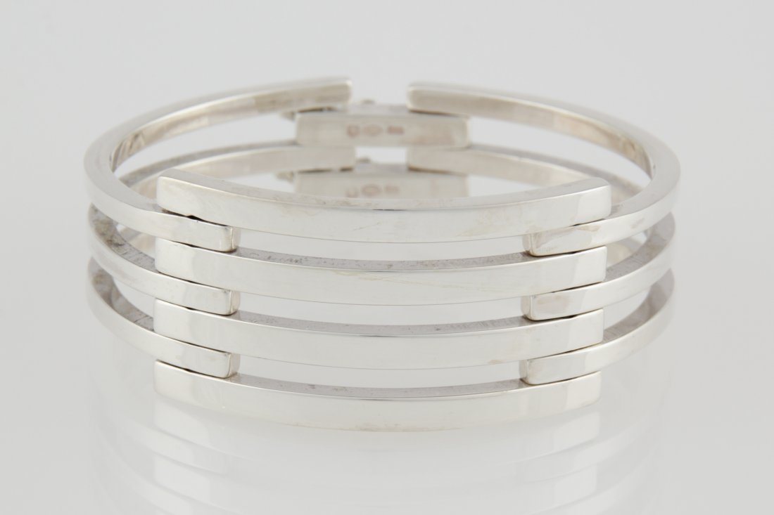 Heavy Silver Bracelet: Silver Bracelet marked Uno A Erre 925 Italy. Heavy. 2.5"W x 1"H (6 x 3 cm). Weight: 66.2 g. Since 1937, the The Silver Shop of Princeton, NJ was located at 59 Palmer Square West.