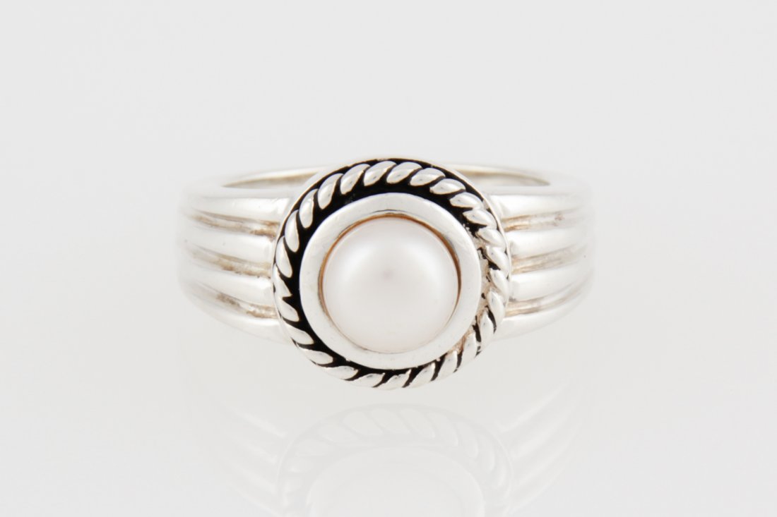 Sterling Silver and Pearl Ring: Sterling Silver and Pearl Ring marked 925. Size: 7. Weight: 7.6 g. Since 1937, the The Silver Shop of Princeton, NJ was located at 59 Palmer Square West.