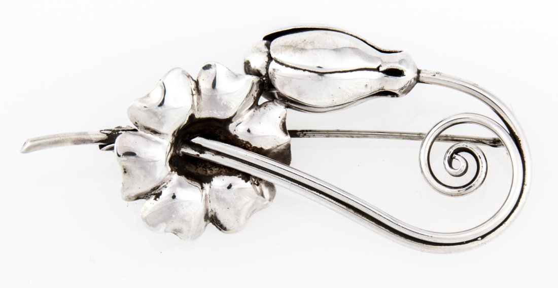 Georg Jensen USA Brooch marked Sterling 121: Georg Jensen USA Brooch marked Sterling 121. 3"W x 1.25"L (8 x 3 cm). Weight: 16.3 g. Since 1937, the The Silver Shop of Princeton, NJ was located at 59 Palmer Square West.