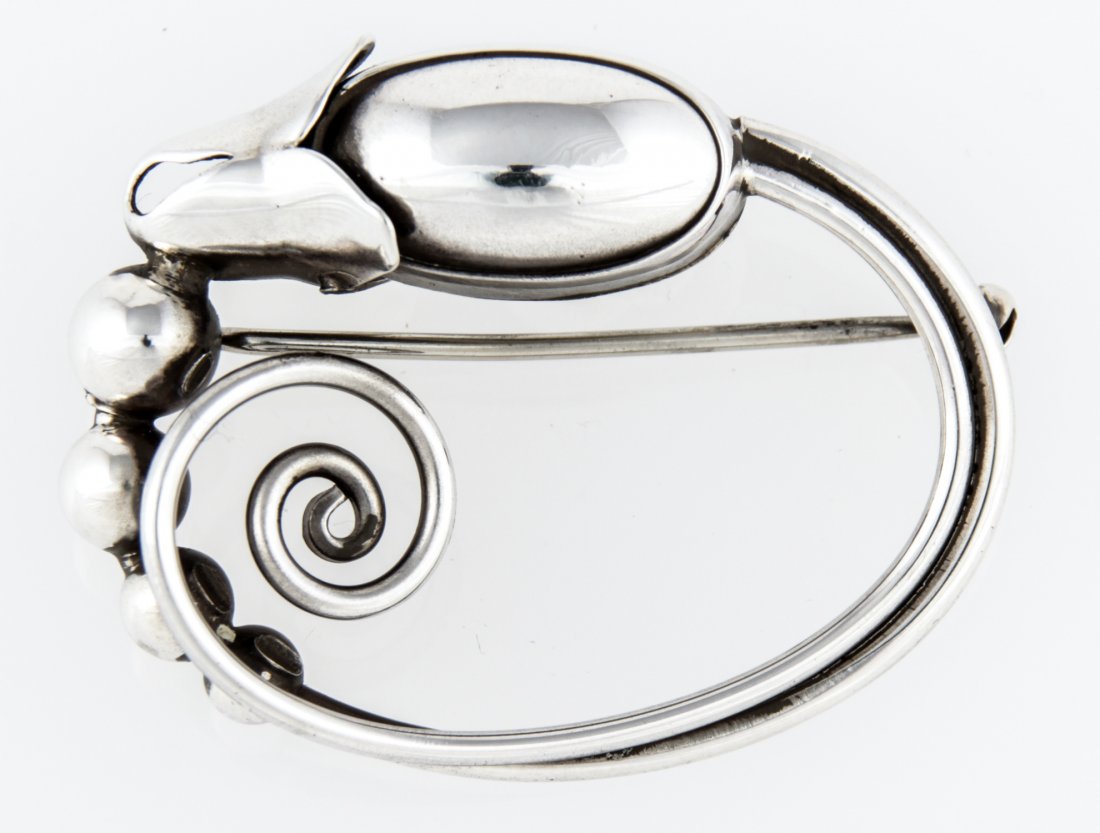 Georg Jensen Handwrought Silver Brooch marked Sterling: Georg Jensen Handwrought Silver Brooch marked Sterling. 1.5" x 1.75" (4 x 4 cm). Weight: 14.4 g. Since 1937, the The Silver Shop of Princeton, NJ was located at 59 Palmer Square West.