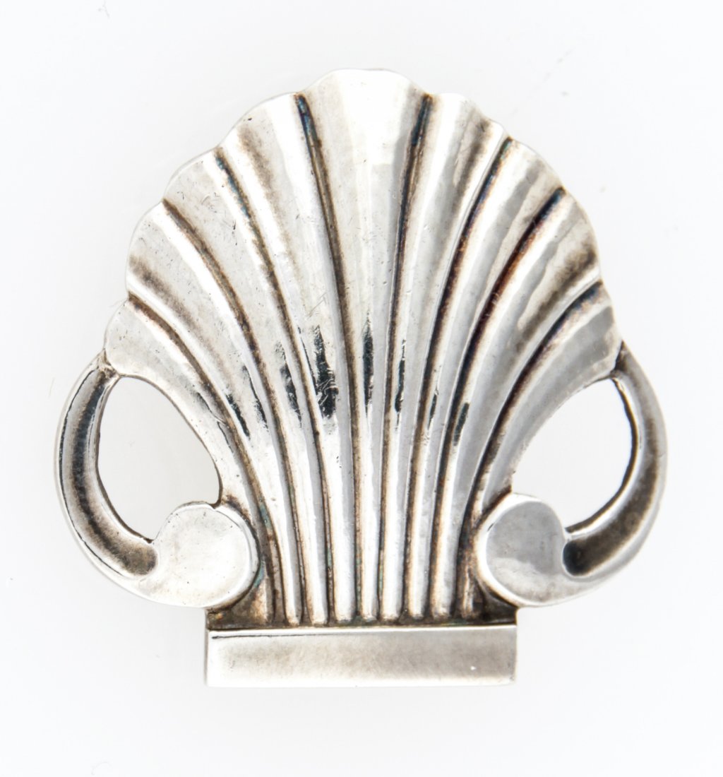 Georg Jensen Silver Brooch marked: Georg Jensen Silver Brooch marked 925 S Denmark 246. 1.25"D (3 cm). Weight: 8.6 g .Since 1937, the The Silver Shop of Princeton, NJ was located at 59 Palmer Square West.