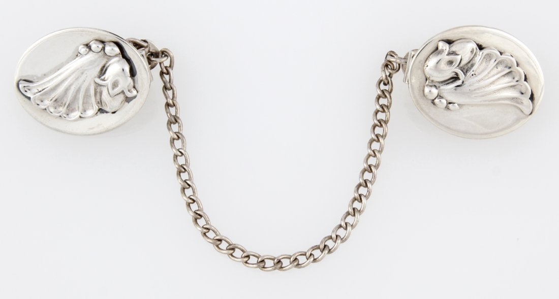 Georg Jensen Silver Dress Clips marked Sterling: Georg Jensen Silver Dress Clips marked Sterling. 1"L (3 cm), chain 4"L (10 cm). Weight: 25.3 g . Since 1937, the The Silver Shop of Princeton, NJ was located at 59 Palmer Square West.