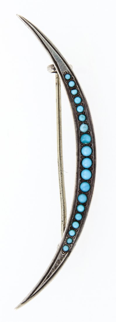 Silver and Turquoise Crescent Brooch: Silver and Turquoise Crescent Brooch marked Sterling. 2.25"L (6 cm). Weight: 2.5 g. Since 1937, the The Silver Shop of Princeton, NJ was located at 59 Palmer Square West.