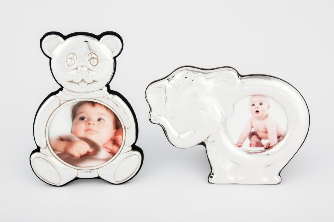Pair of Sterling Silver and Mahogany Baby Frames: Pair of Sterling Silver and Mahogany Baby Frames, tallest 6"H (15 cm).Since 1937, the The Silver Shop of Princeton, NJ was located at 59 Palmer Square West.