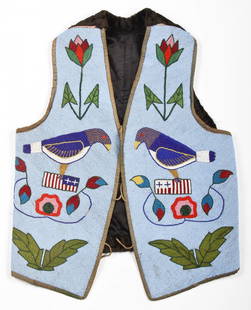 Plains Beaded Vest: Plains Beaded Vest, early 20th c. Glass beads throughout front, fine cotton backing; dark velvet back. Length: approx 24 inches. Pictured in an early photo of Joe Grimm's collection. Provenance: