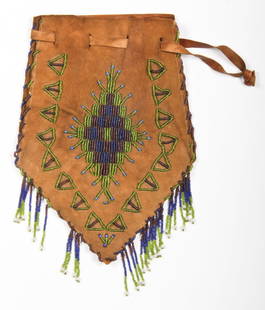 Plains Beaded Tobacco Pouch: Plains Beaded Tobacco Pouch, early 20th c. Leather, glass beads. Size: 11" x 8.25" (28 x 21 cm). Provenance: Joseph Grimm, by descent to current owner Robert Panchison.