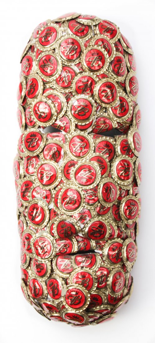 Gregory "Mr. Imagination" Warmack, (American,: Gregory "Mr. Imagination" Warmack, (American, 1948-2012) Bottlecap Mask, found object sculpture. Size: 14" x 6" x 4" (36 x 15 x 10 cm).