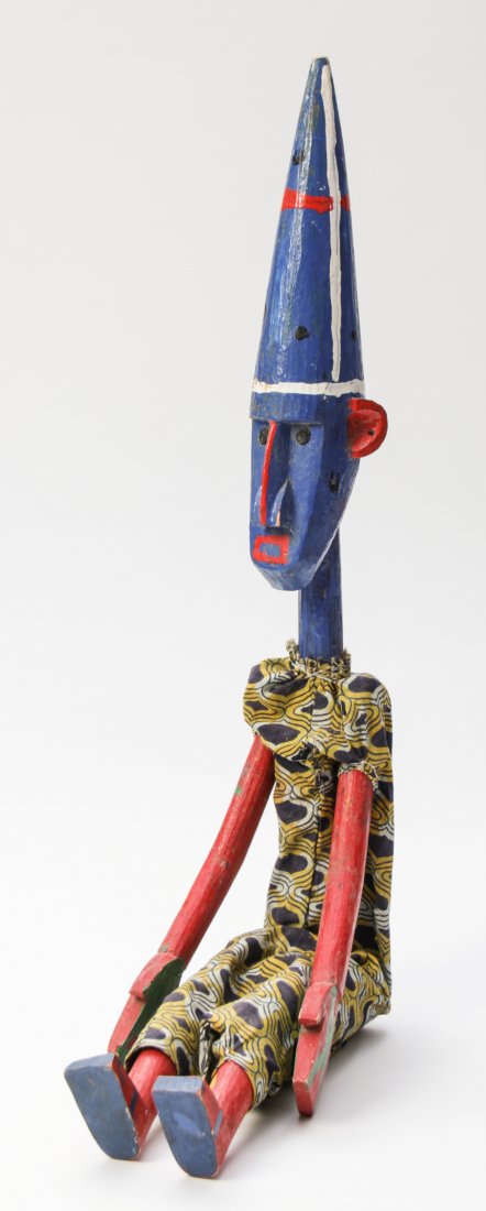 Bozo Puppet: Bozo Puppet, African. Carved and painted wood, with fabric clothing. Size: 34" x 5" x 4" (86 x 13 x 10 cm).