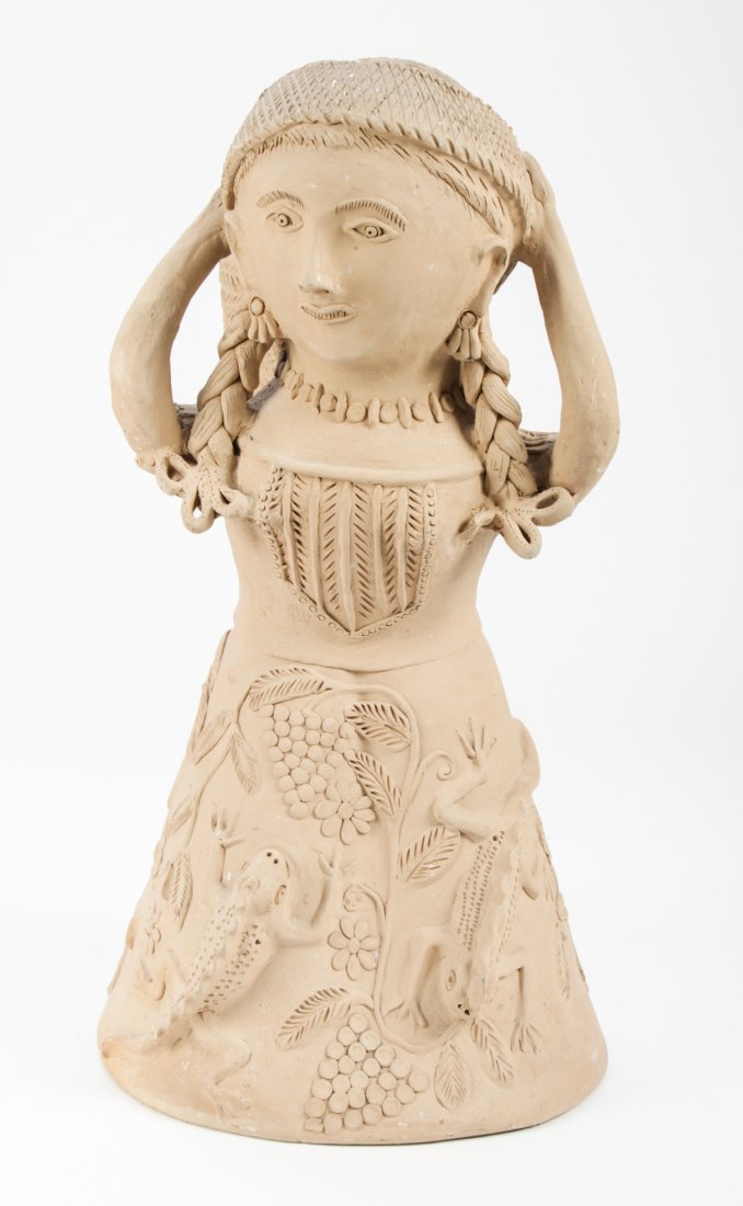 Mexican Earthenware Figure: Mexican Folk Art earthenware figural planter, monogrammed D.C.D. Size: 25" x 12" x 12" (63 x 30 x 30 cm).