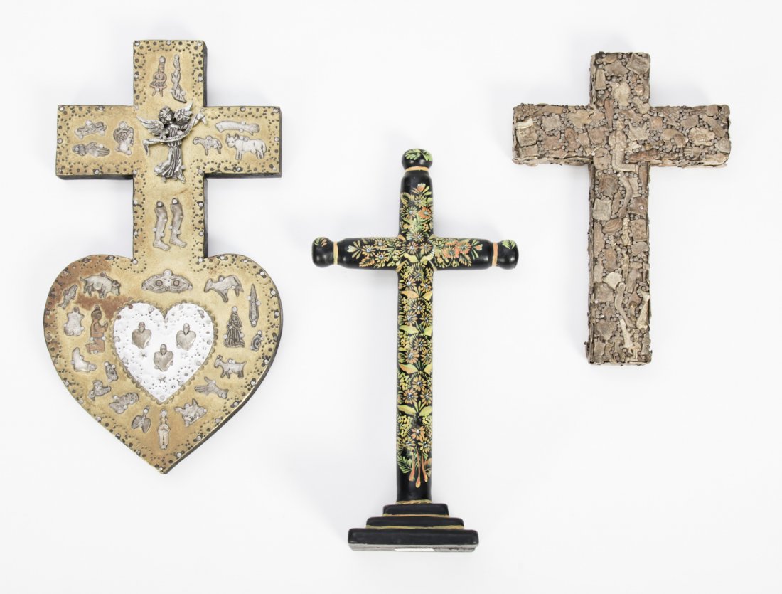 3 Mexican Folk Art Crucifixes: 3 Mexican Folk Art Crucifixes including: 1) a painted wood cross; 2) a profusely decorated Milagro (miracle medal) cross; 3) a metal clad sacred heart milagro cross, signed Armando Garcia '97. Ranging
