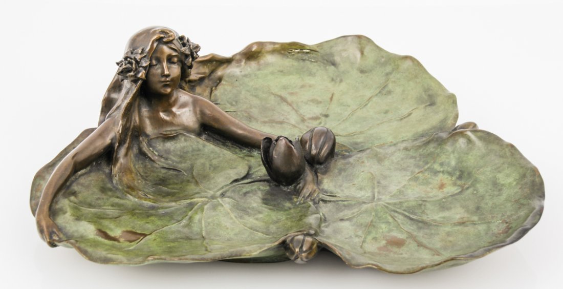 Raoul Larche Bronze Art Nouveau Tray: Raoul Larche Bronze. Size: 4" x 13.5" x 12" (10 x 34 x 30 cm).Raoul Larche, French, 1860-1912. Bronze Art Nouveau tray, Lily pad form with a young woman grasping the central lily. Incised signature "R