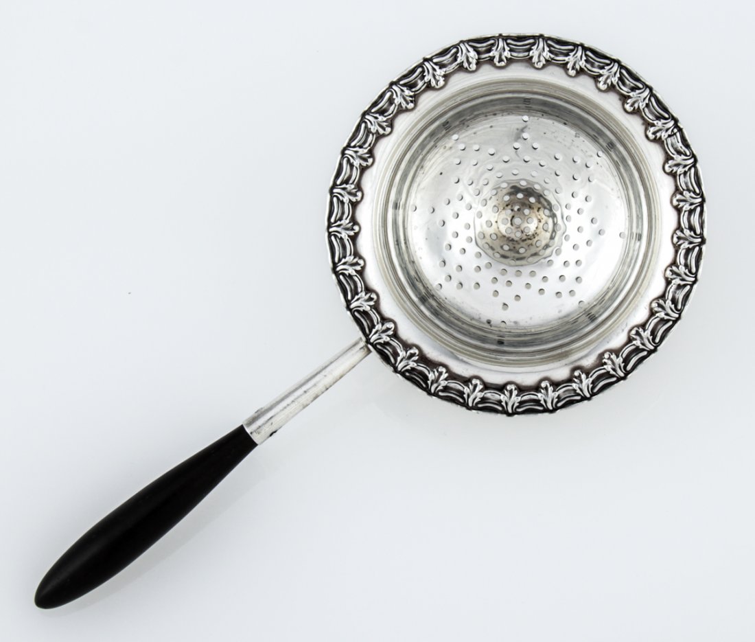 Tiffany & Co. Silver Tea Strainer with Ebony Handle: Tiffany & Co. Silver Tea Strainer with Ebony Handle marked Sterling. 6.5"L (17 cm). Weight: 54 g.