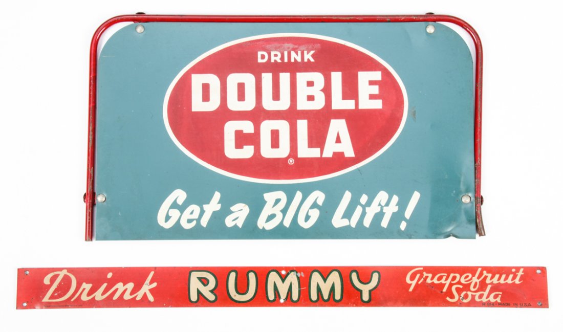 2 Vintage Soft Drinks Signs: Group of 2 Vintage Soft Drinks Signs. Consisting of a Bubble Cola panel and a Rummy Soda door handle banner. Both painted metal. Size: 1.5" x 19.5" (4 x 50 cm) and 8.5" x 15" (22 x 38 cm).